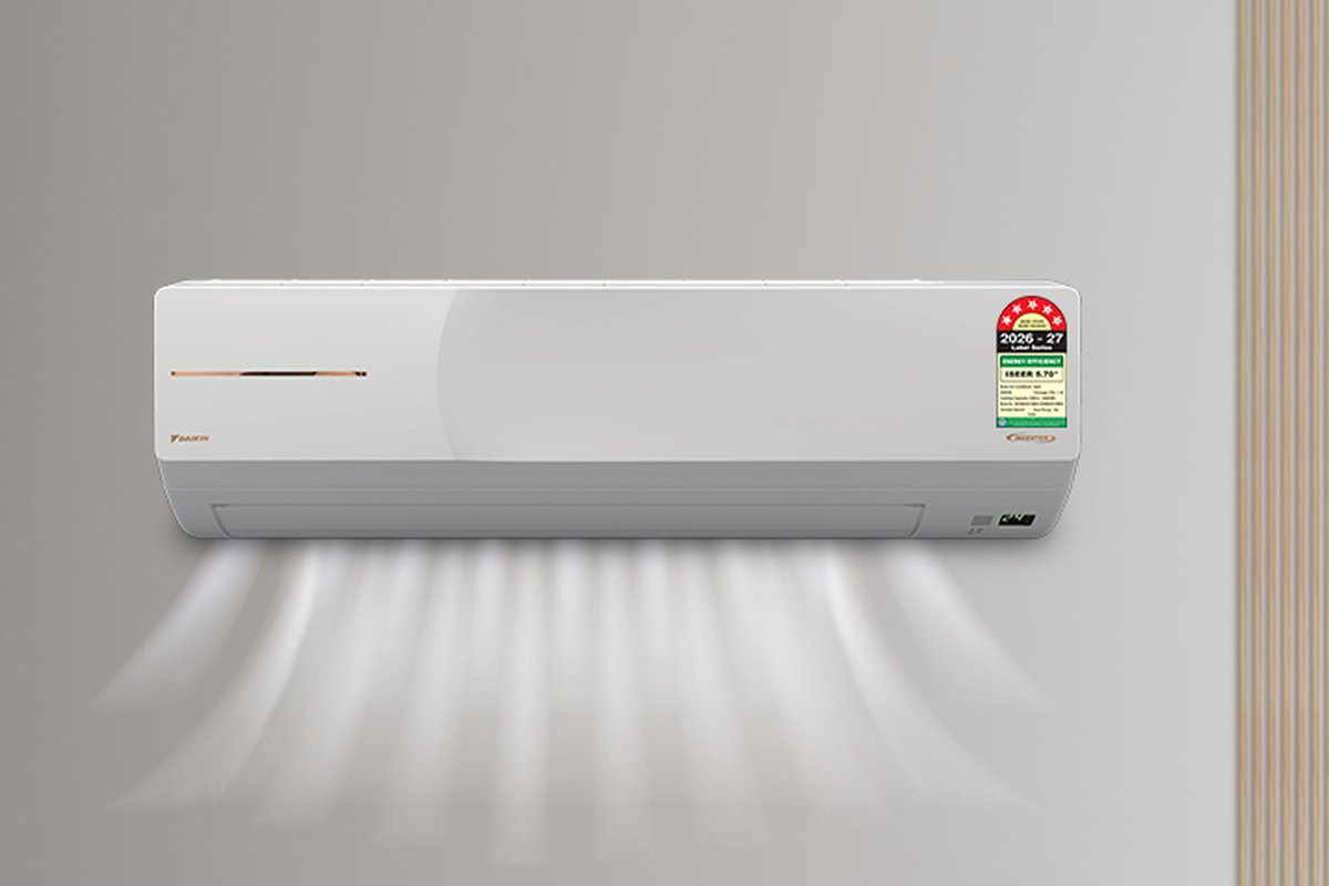 Daikin MTKM50XV16 1.5-ton split AC indoor unit on a grey wall with its BEE label